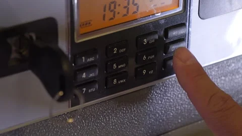 A man enters the correct code into the keypad of a safe 스톡 동영상 277593037
