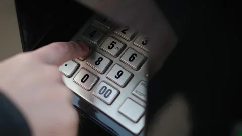 A man enters the pin code of a bank card in the terminal, close-up Stock Footage 241097509