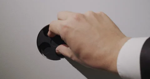The man enters the pin code on the door of the safe and takes the money from Stock Footage 152260592