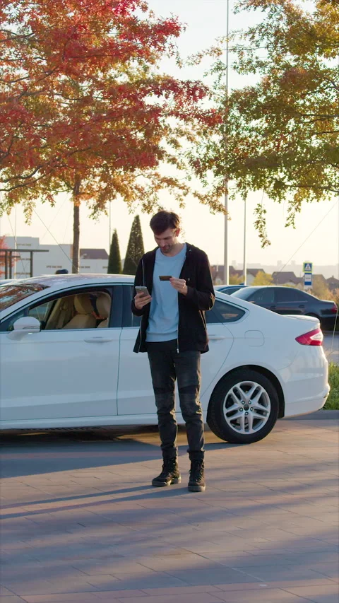 Man enters PIN code on phone to gain access to vehicle Stock Footage 300549912