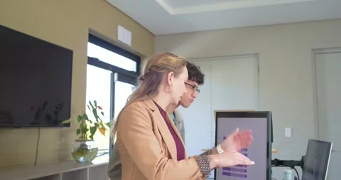 With man entry, Diverse coworkers tapping laptop examining bar chart preparing Stock Footage 334999656