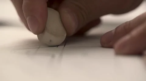 Man erasing and re-drawing in a technical blueprint Stock Footage 67444394