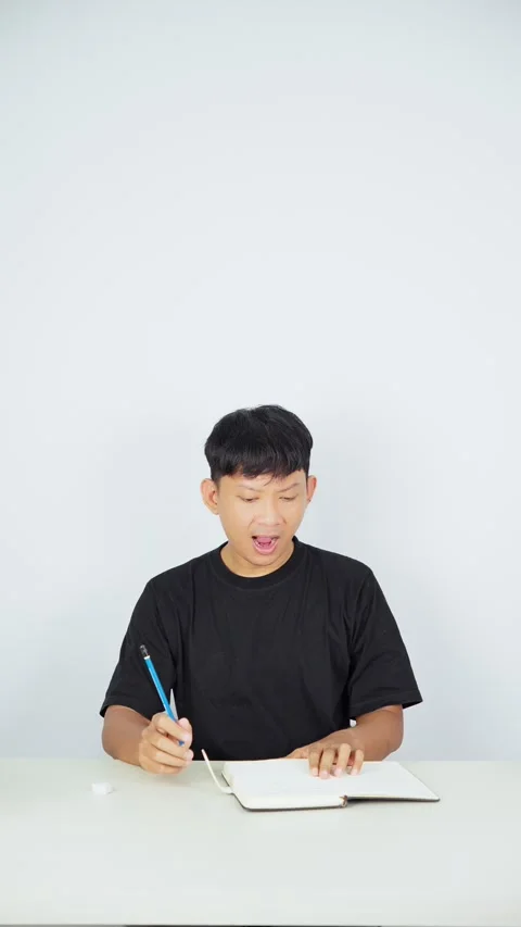 Man Erasing Incorrect Pencil Writing With Eraser Video stock 347105314
