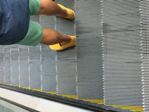 Man in the escalator Stock Photos