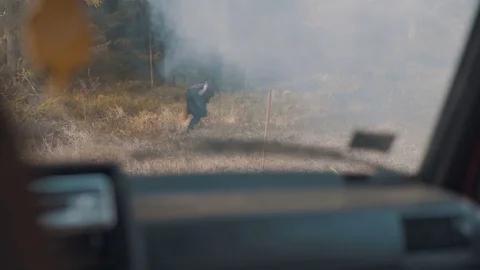 Man escapes from the chasing car and hides in the forest Stock Footage 83222975