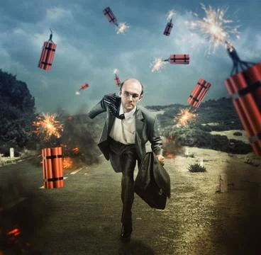 Man escaping from dynamite exploding Stock Photos