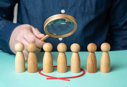 A man evaluates people figures through a magnifying glass. Search for candida Stock Illustration