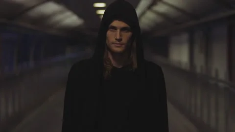 Man with an Evil Look on His Face Walking in an Underpass Stock Footage 150088003