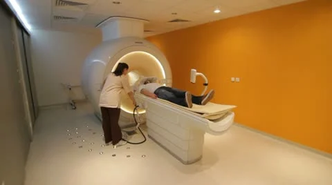 Man examined by MRI scan Stock Footage