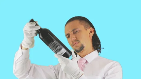 A man examines a bottle of wine Video stock 41417987