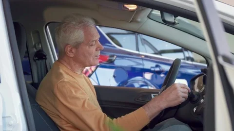 Man examines interior of the car Stock Footage 73734767