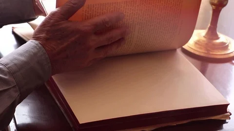 Man examining an antique book Stock Footage 109363602