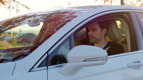 Man examining a car interior before a test drive, showcasing attention to detail Stock Footage 316836241