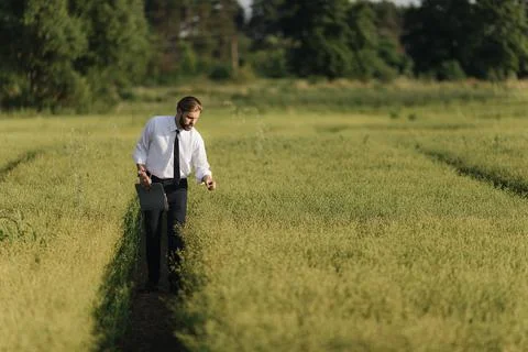 Man examining crops with tablet Stock Photos