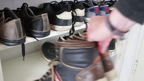 Man exchanges a pair of shoes on the shelf Stock Footage 81673013