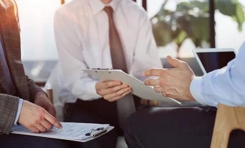 Man exchanging contract or document for signing 스톡 사진