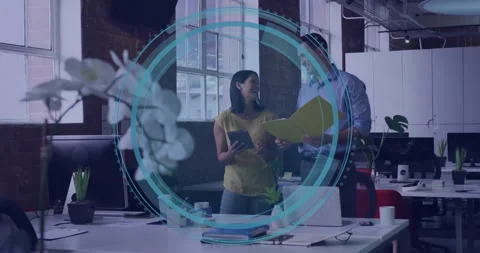 Man exchanging folder with woman tapping tablet and initiating digital rings Stock Footage 310430347