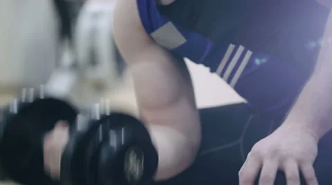 Man execute exercise with dumbbells in gym Video stock 59160818