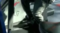 Man on exercise bike, pan from legs to head HD Footage
