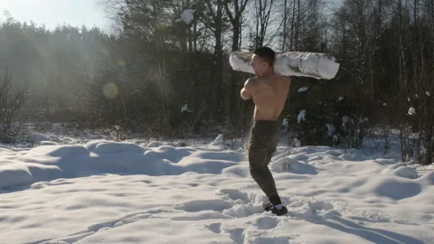 Man exercise with log, timber outdoors at snow. Stock-Footage 147222661