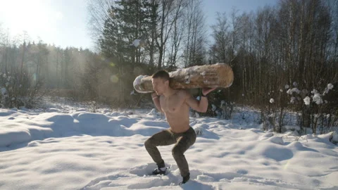 Man exercise with log, timber outdoors at snow Stock-Footage 147224621