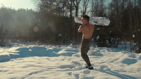 Man exercise with log, timber outdoors at snow. Stock Footage 148497017