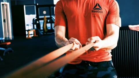 Man exercise with resistance band Video stock 166579093