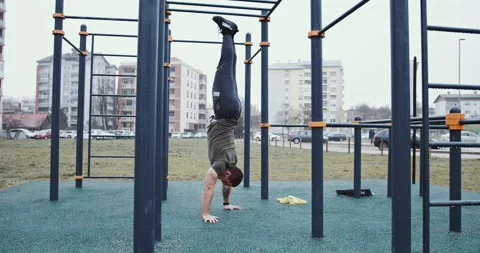 Man exercising and hand standing in outdoor fitness Stock Footage 145347091