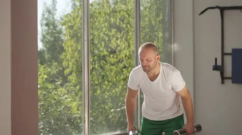 Man Exercising with Arm Weights Stock Footage 51825382