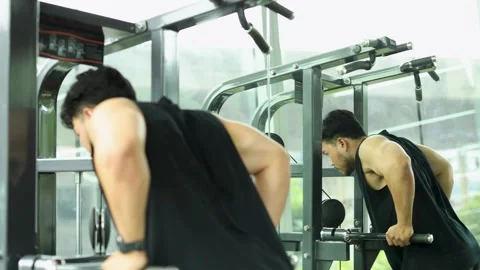Man Exercising on Assisted Pull-Up Machine in Gym Stock Footage 327767218