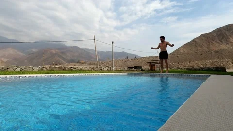 A man exercising with a beautiful view of mountains and clear blue sky in a coun Stock Footage 199540953