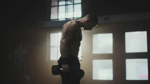 Man exercising biceps with dumbbells Stock-Footage 236179606