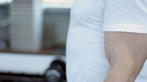 Man exercising biceps in a gym Video stock 91862221