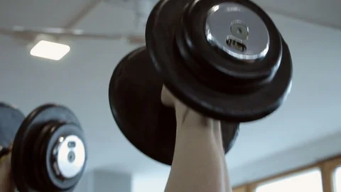 Man exercising biceps in a gym Video stock 97705565