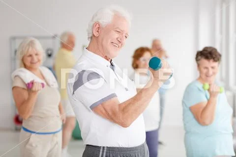 Man exercising biceps Stock Photos