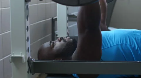 Man Exercising, Doing the Bench Press in the Gym Video stock 49102219