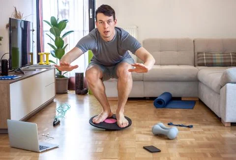 Man exercising doing workout at home Stock Photos