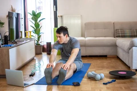 Man exercising doing workout at home Stock Photos