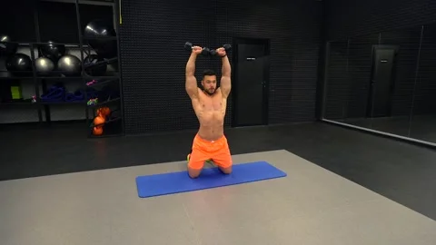 Man exercising with dumbbells in the gym Stock Footage 211651716