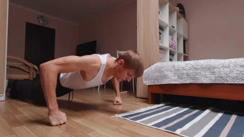 Man Exercising At Home Slow Motion Stock Footage 162185365
