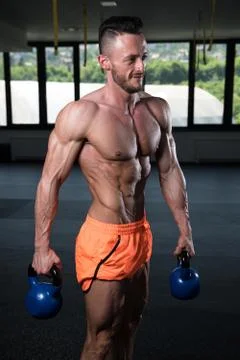 Man Exercising With Kettle Bell Stock Photos