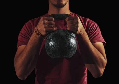 Man exercising with a kettlebell Stock Photos
