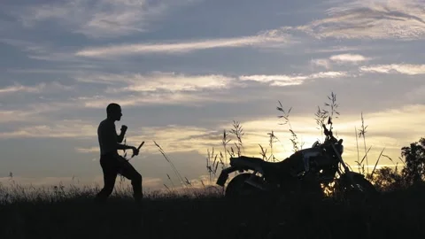 Man exercising with nunchucks at sunset Stockbeeldmateriaal 153416326