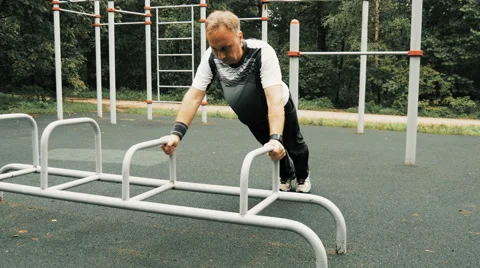 A man is exercising at an open pitch Video stock 66543111