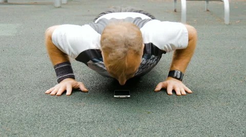 A man is exercising at an open pitch Video stock 66549673