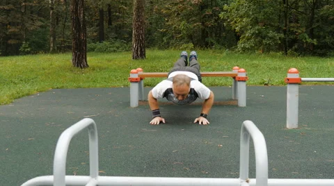 A man is exercising at an open pitch Video stock 66549873