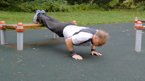 A man is exercising at an open pitch. Video stock 66550869