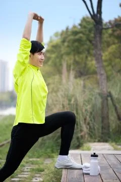 A man is exercising outdoors Stock Photos