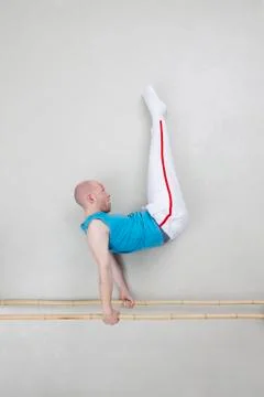 Man exercising on parallel bars 스톡 사진