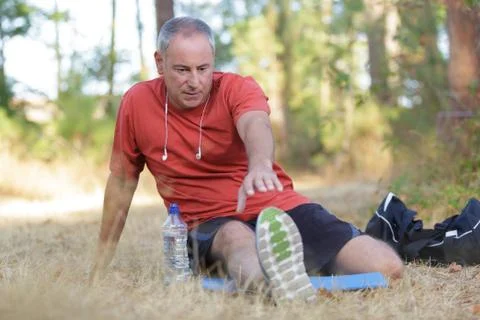 Man is exercising in park Stock Photos
